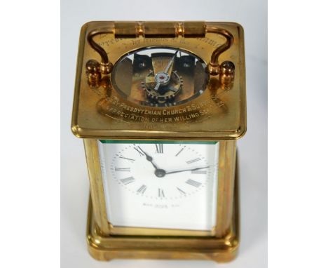LATE 19th CENTURY BRASS TIMEPIECE CARRIAGE CLOCK, the dial inscribed Rus Ells Ltd, Paris, engraved with a presentation inscri