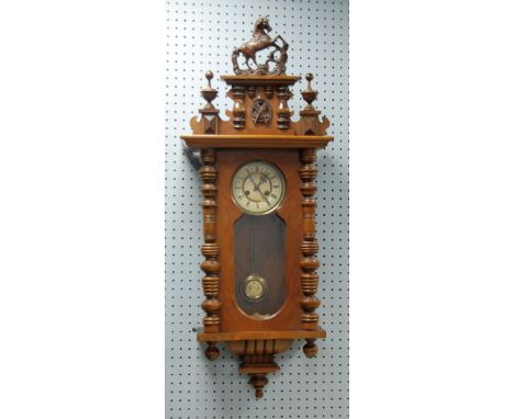 EARLY TWENTIETH CENTURY VIENNA STYLE WALNUT AND STAINED BEECH WALL CLOCK, the 6 1/2" two part Roman dial powered by a spring 