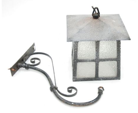 LARGE WROUGHT IRON PORCH LANTERN, tapering square form with frosted dimple glass panels and overhanging rim, WITH WROUGHT IRO