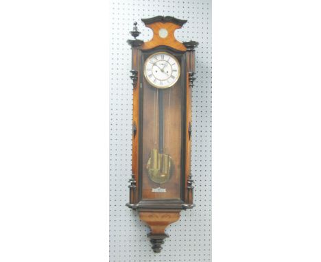 LATE 19th CENTURY VIENNA STYLE WALL CLOCK IN WALNUT PARCEL EBONISED CASE, the white enamel dial with Roman numerals, the two 