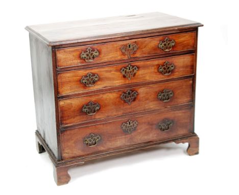EARLY NINETEENTH CENTURY MAHOGANY CHEST OF DRAWERS, the moulded oblong top above four long graduated and cockbeaded drawers, 
