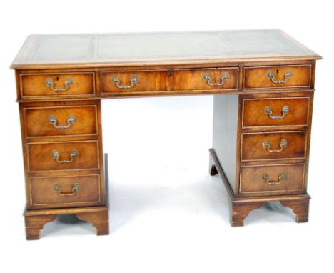 MODERN GEORGIAN STYLE TWIN PEDESTAL MAHOGANY DESK, the moulded oblong top with antique green leather inset top, above three c