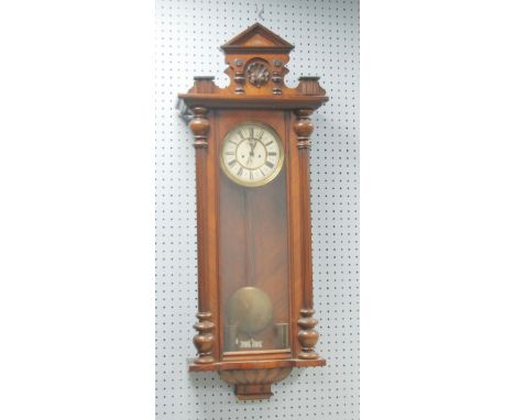 LATE NINETEENTH/EARLY TWENTIETH CENTURY WALNUTWOOD AND STAINED BEECH VIENNA WALL CLOCK by Gustave Becker, the 8" two part Rom