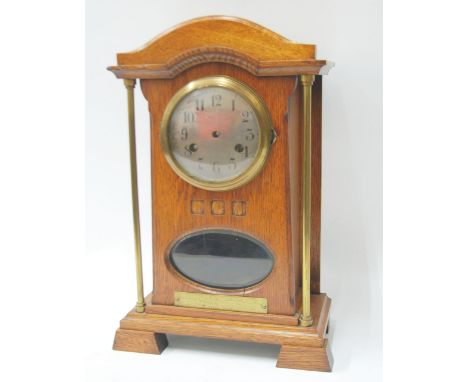 EARLY TWENTIETH CENTURY JUNGHANS OAK CASED PRESENTATION MANTEL CLOCK, in the Arts and Crafts style, the 4 1/2" silvered Arabi