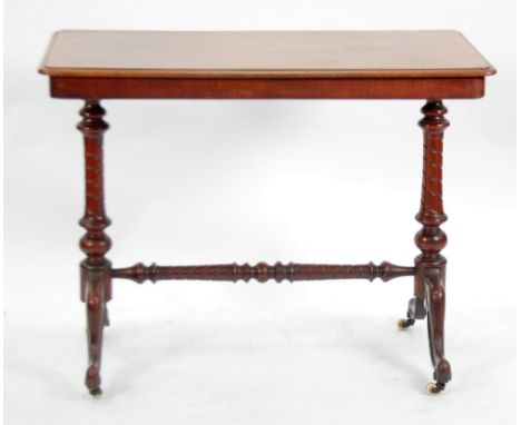 VICTORIAN FIGURED MAHOGANY WINDOW TABLE on turned supports to scroll cheval supports  with ceramic casters, 36" (91.5cm) wide