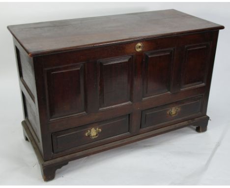 ANTIQUE OAK DOWER CHEST, the moulded oblong hinge top above four fielded panels and pair of basal drawers to the front, raise