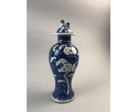 BLUE AND WHITE VASE WITH COVER, with foliate decoration, the lid with foe dog finial, with marks to underside, 27.5cm high