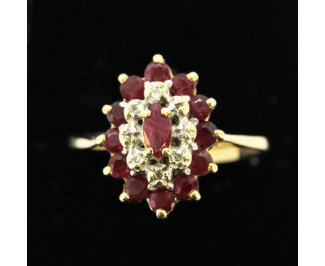 A 9ct yellow gold ruby and diamond set ring, (O) (needs re-shaping).