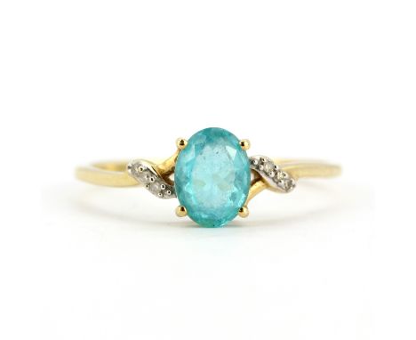 A 9ct yellow gold ring set with an oval cut apatite and diamonds, (T.5).
