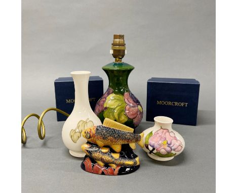 A Moorcroft lamp base H. 23cm, with two Moorcroft vases and a Moorcroft figure of two carp.
