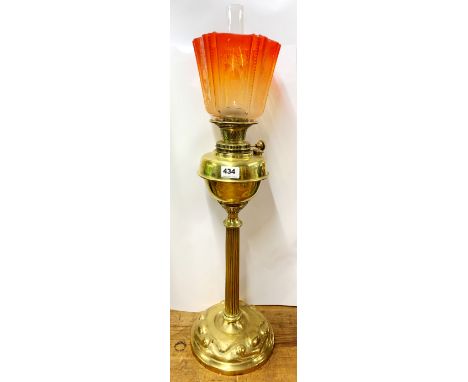 An impressive Art Nouveau hammered brass column oil lamp with frosted orange glass shade, H. 72cm.