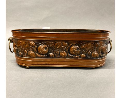 A hammered copper planter, W. 46cm.