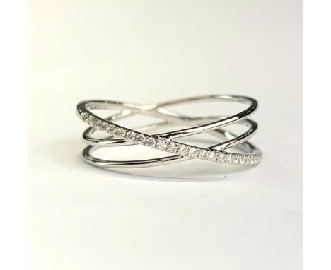 An 18ct white gold (tested) crossover ring set with brilliant cut diamonds, (N).