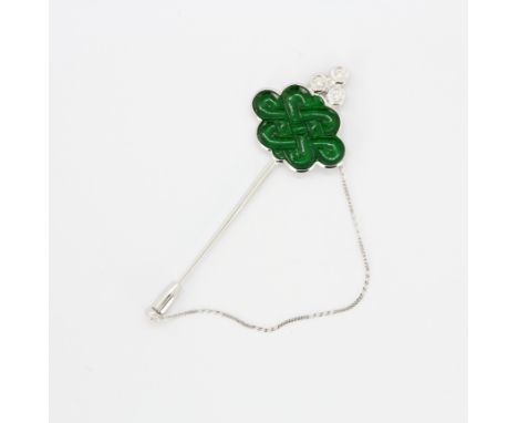 A boxed 14ct white gold (stamped 14k) carved jade and diamond set stick pin, 7cm.