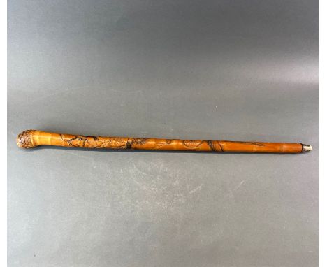 A Japanese carved bamboo walking stick, L. 90cm.