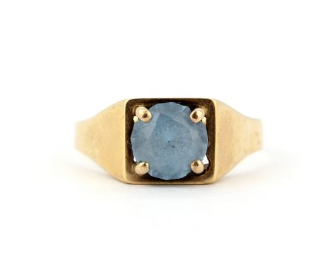 A 9ct yellow gold ring set with a blue stone, (T.5).