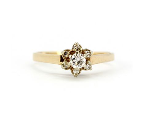 A 9ct yellow gold (stamped 375 and 14k) diamond set flower shaped ring, (P).