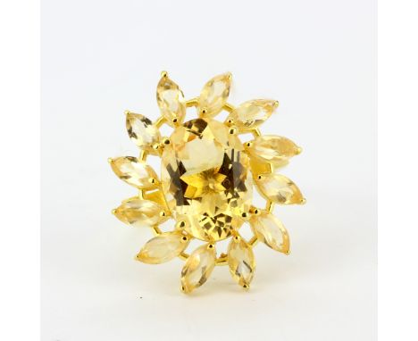 A gold on 925 silver cluster ring set with an oval and marquise cut citrines, (O).