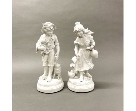 A pair of French bisque porcelain figurines, H. 33cm.