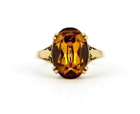 A 9ct yellow gold ring set with an oval cut stone, (T.5).