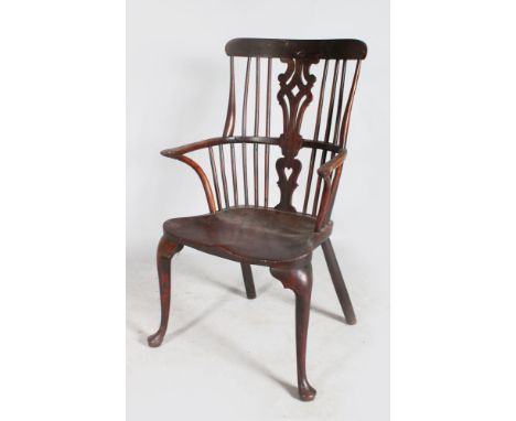 A GOOD GEORGE II YEW WOOD COMB BACK ARMCHAIR with curving back, pierced and routed splat, soldi seat, curving arms and cabrio