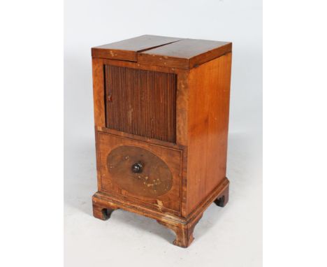 A GEORGIAN MAHOGANY CONVERTED WASH STAND with a pair of flaps, tambour front, deep drawer below, supported on bracket feet. 1