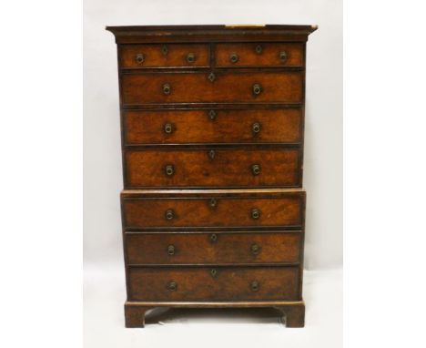 A GOOD GEORGE II WALNUT TALLBOY , the top with two short and three long graduated drawers with brass handles, three long grad