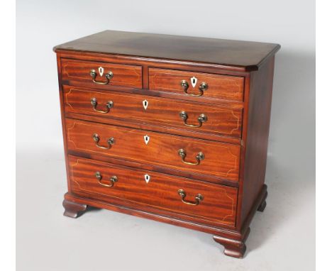 A GEORGE III MAHOGANY CHEST of two short and three long drawers with brass handles, supported on bracket feet. 2ft 9ins wide.