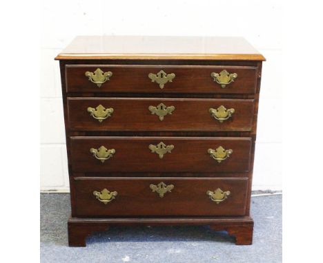 AN EARLY GEORGE III MAHOGANY CHEST, with four graduated long drawers with later brass handles, on bracket feet. 2ft 5ins wide