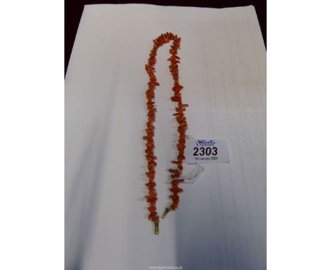 A vintage coral coloured bead necklace, 16" long.