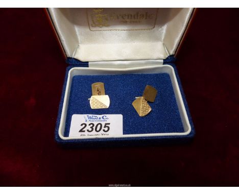 A pair of 9ct gold cufflinks, Birmingham, having engine turned detail.