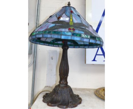 A Tiffany style bronzed table lamp with leaded shade