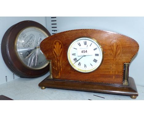 An Edwardian inlaid mahogany mantel clock with balance spring movement; a circular aneroid barometer