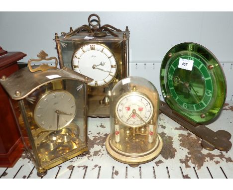 A 1930's electric green mirrored mantel clock; 3 gilt 400 day mantel clocks