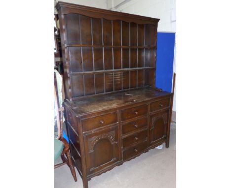 A 1930's Welsh dresser with shelf over cupboard and drawers