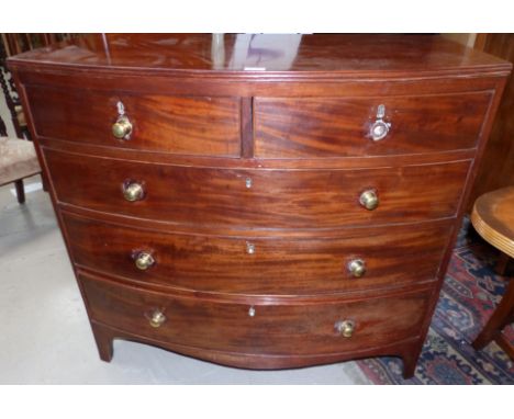 A Victorian mahogany bow front chest of 3 long and 2 short drawers with brass knob handles, on splay bracket feet