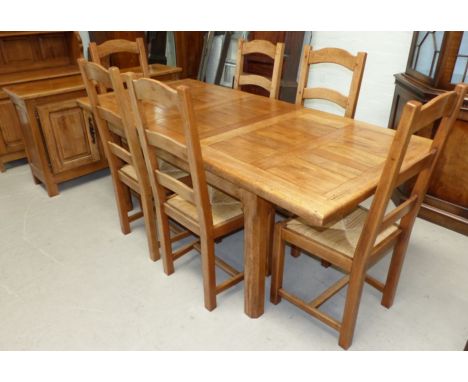 A distressed oak period style dining suite by Wesley Barrell, comprising rectangular extending table with 2 spare leaves, 6 l