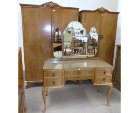A bleached walnut period style bedroom suite comprising double wardrobe, single wardrobe, dressing table and stool