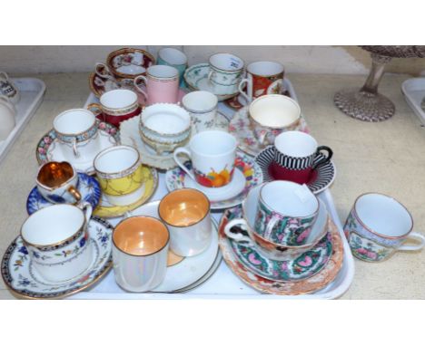 A collection of cabinet coffee cups and saucers