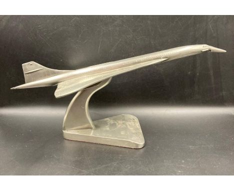 A desk top model of Concorde on plinth 