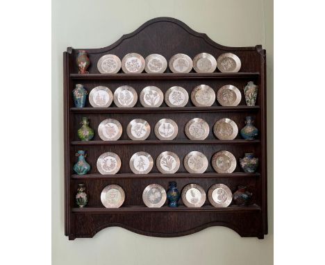 A collection of miniature plates along with enamel perfume bottles 