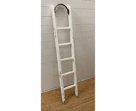 A white painted distressed vintage ladder 