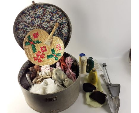 A vintage hat travel box containing ladies accessories such as toiletries shoe horn, purses, scarves, gloves, stole, etc.