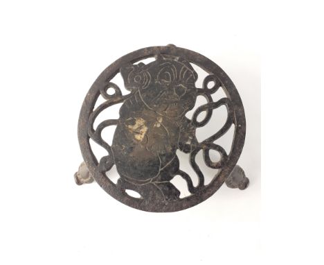 An interesting little cast iron teapot stand with an image of a PUG dog.  Unusual. 15cm across approx.