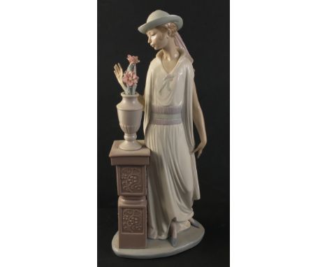 A  LLADRO hand-made sculpture No: E-10 F - tall, elegant and delicately coloured Swinging 20s and 30s female figurine standin