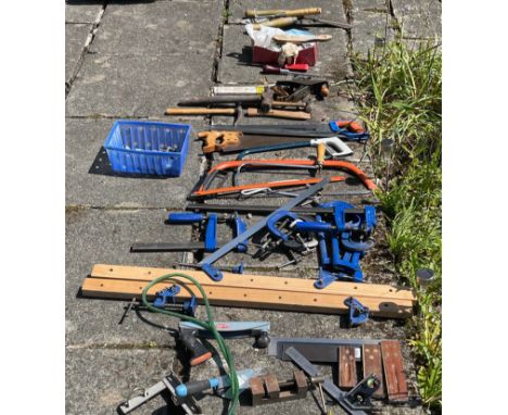 A very useful box of tools containing saws, clamps etc.