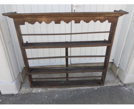An antique Victorian wooden wall plate rack.  Measures 106cm x 103cm. A little loose in places and needs a wax, but an intere