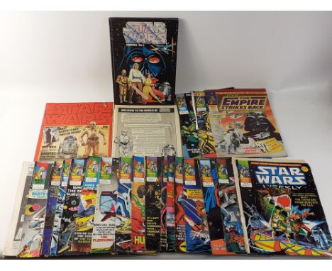 A STAR WARS ANNUAL no. 1, a Star Wars OFFICIAL POSTER MAGAZINE No 3, The STAR WARS Storybook, plus a collection of STAR WARS 