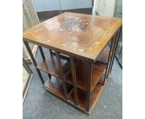 An EDWARDIAN inlaid revolving bookcase on brass castors with light wear on top  - dimensions 57cm height x 50cm square top ap