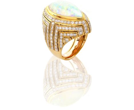 Approx. 12.0 Carat Marquise Cut Opal, 3.0 Carat Pave Set Round Brilliant Cut Diamond and 18 Karat Yellow Gold Ring. Opal with